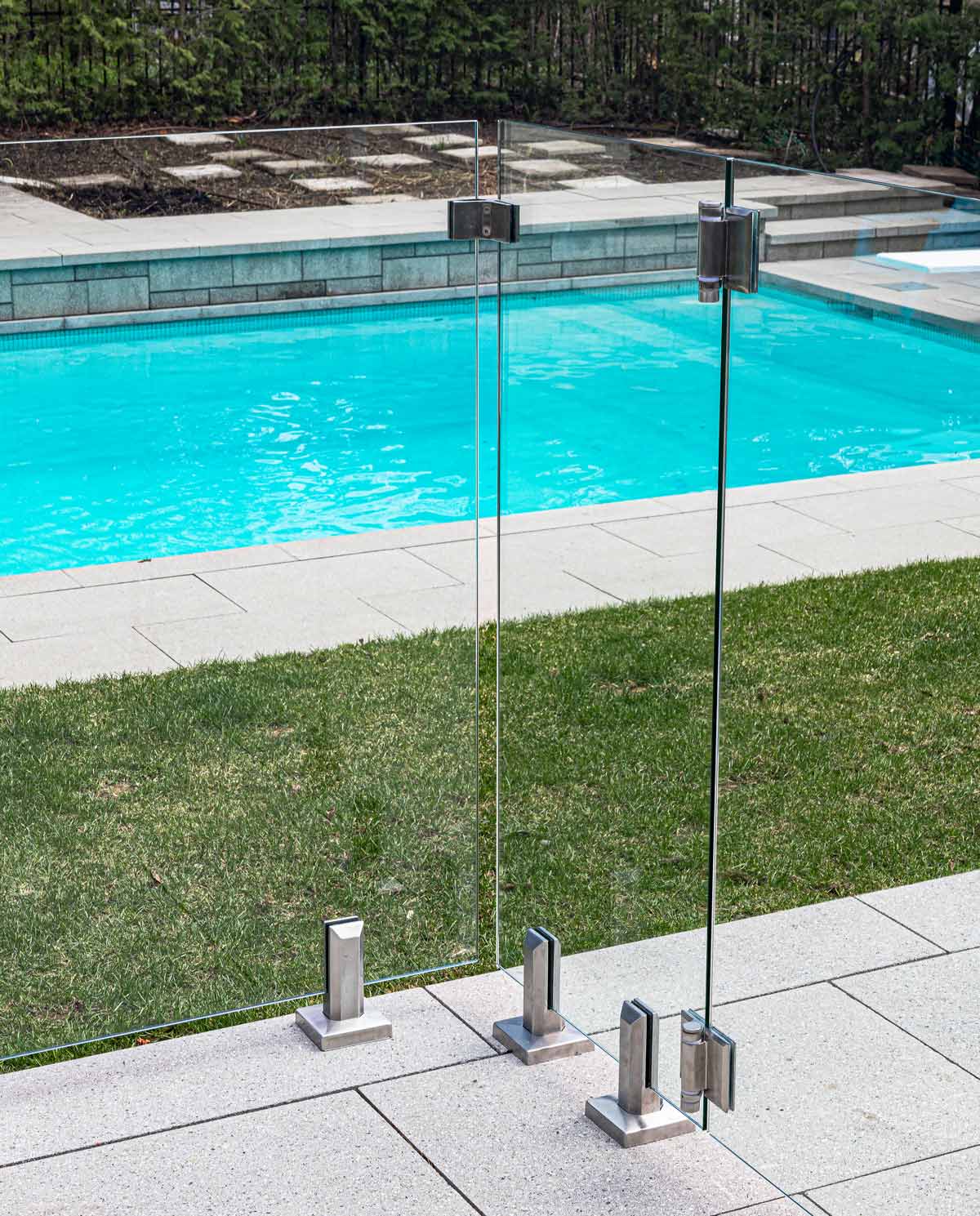 Core drill spigot for pool fence