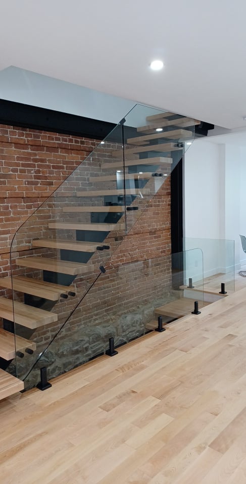 Interior glass railing on modern staircase