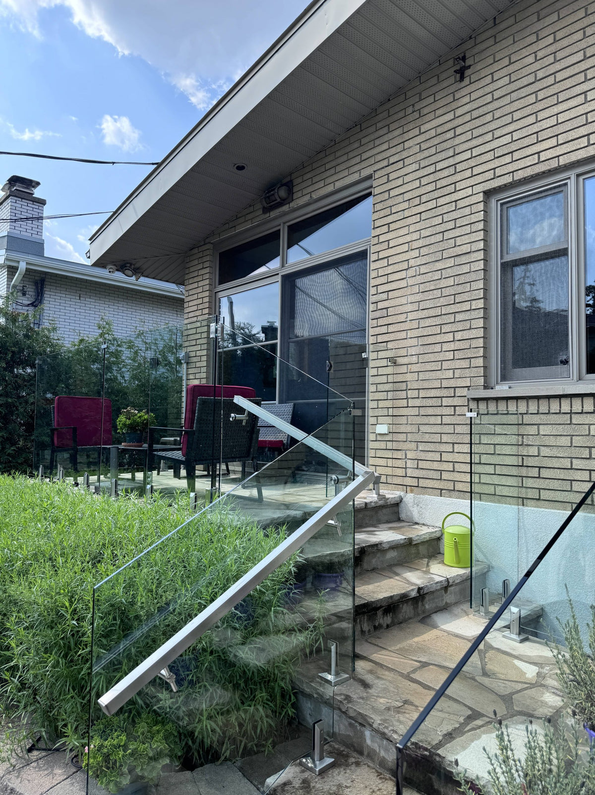 Clean frameless glass railing on deck