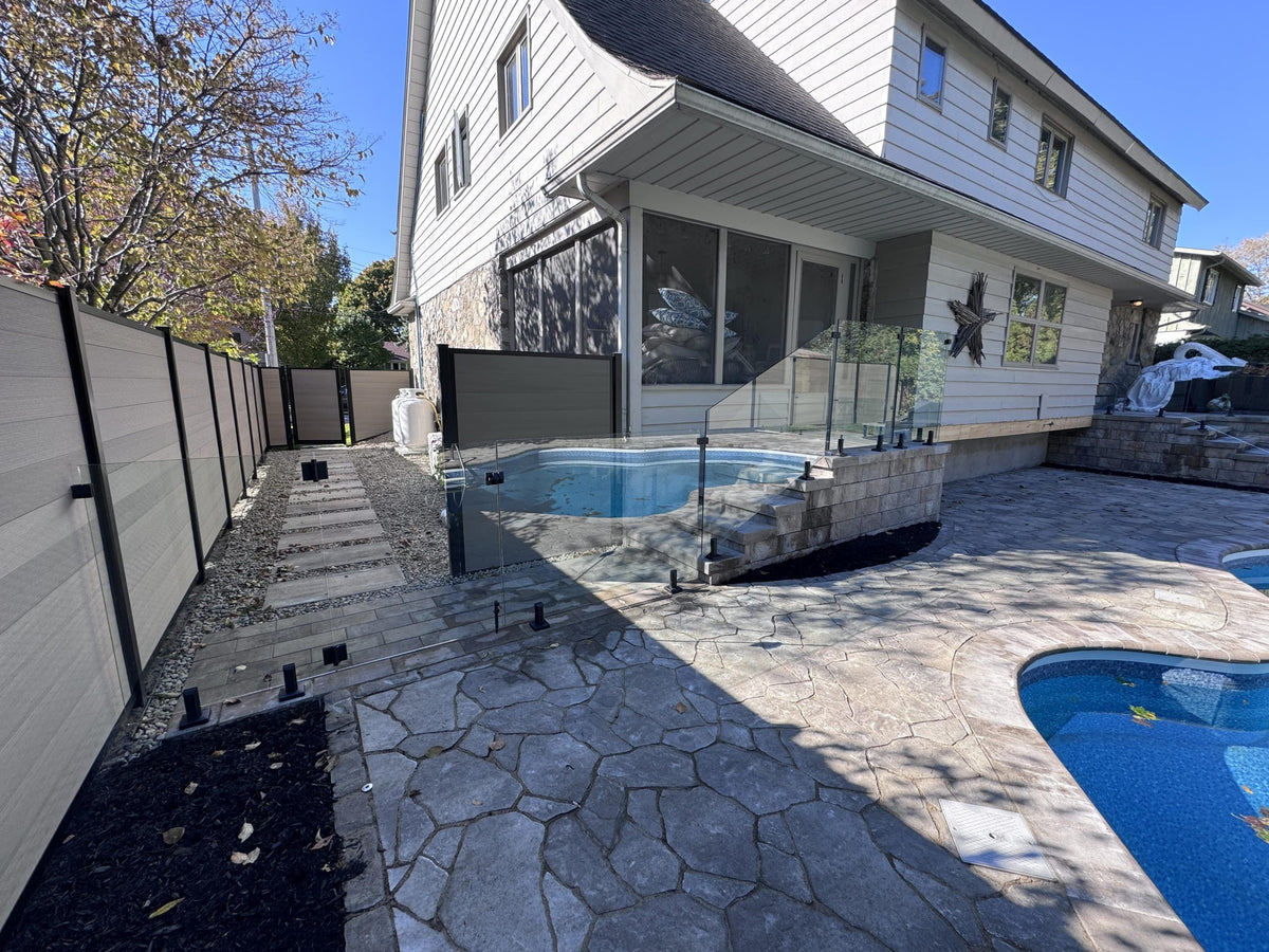 Glass railing on residential deck replacing wood