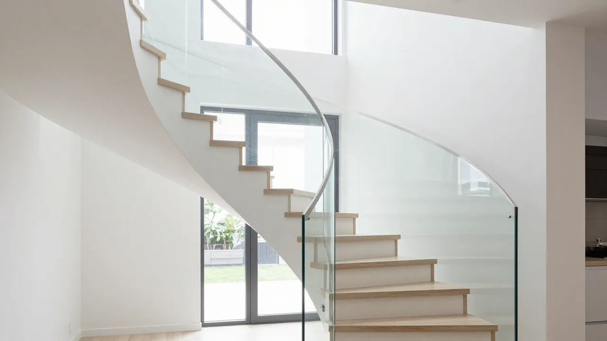 Safe glass railing on modern interior staircase